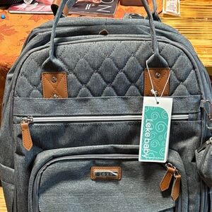 Diaper bag and changing area in one